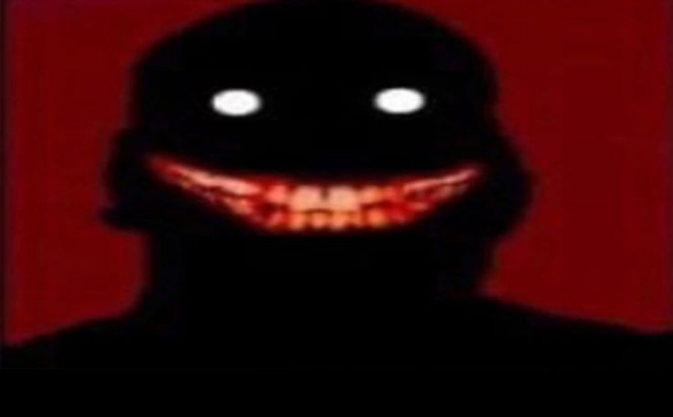 an evil looking man with glowing eyes and fangs on his face is shown in the dark