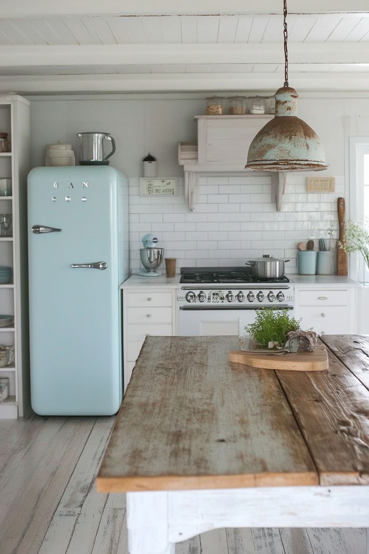 an old - fashioned refrigerator sits in the center of this rustic kitchen