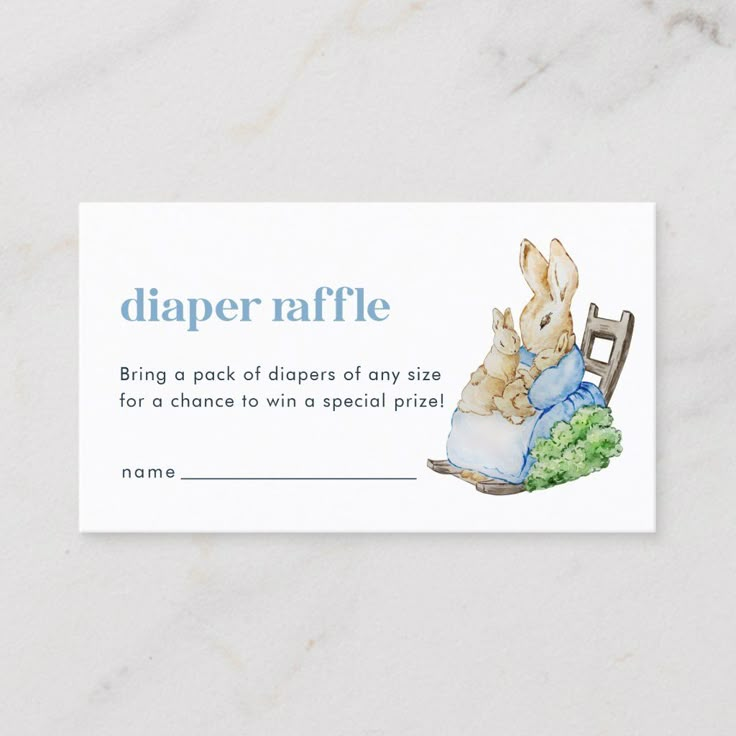 a diaper raffle card with a baby bunny sitting in a chair on it