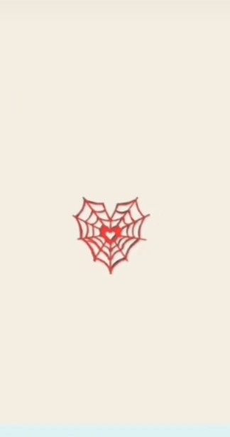 a red spider web with a heart on it's back side, in the middle of a white background