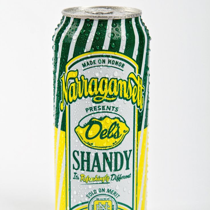 a green and white striped soda can on a white background with the words,'de's shandy '