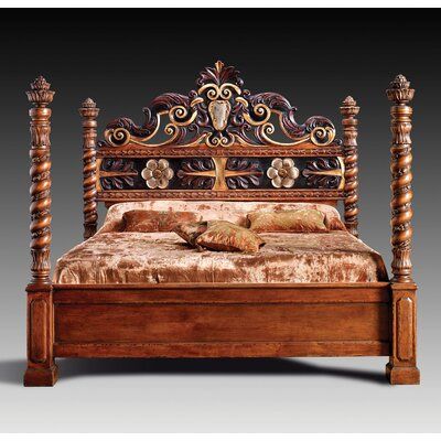 an ornate wooden bed frame with carved wood posts and headboard, made in america