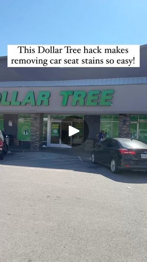 a dollar tree store with cars parked in the lot and an advertisement on the front