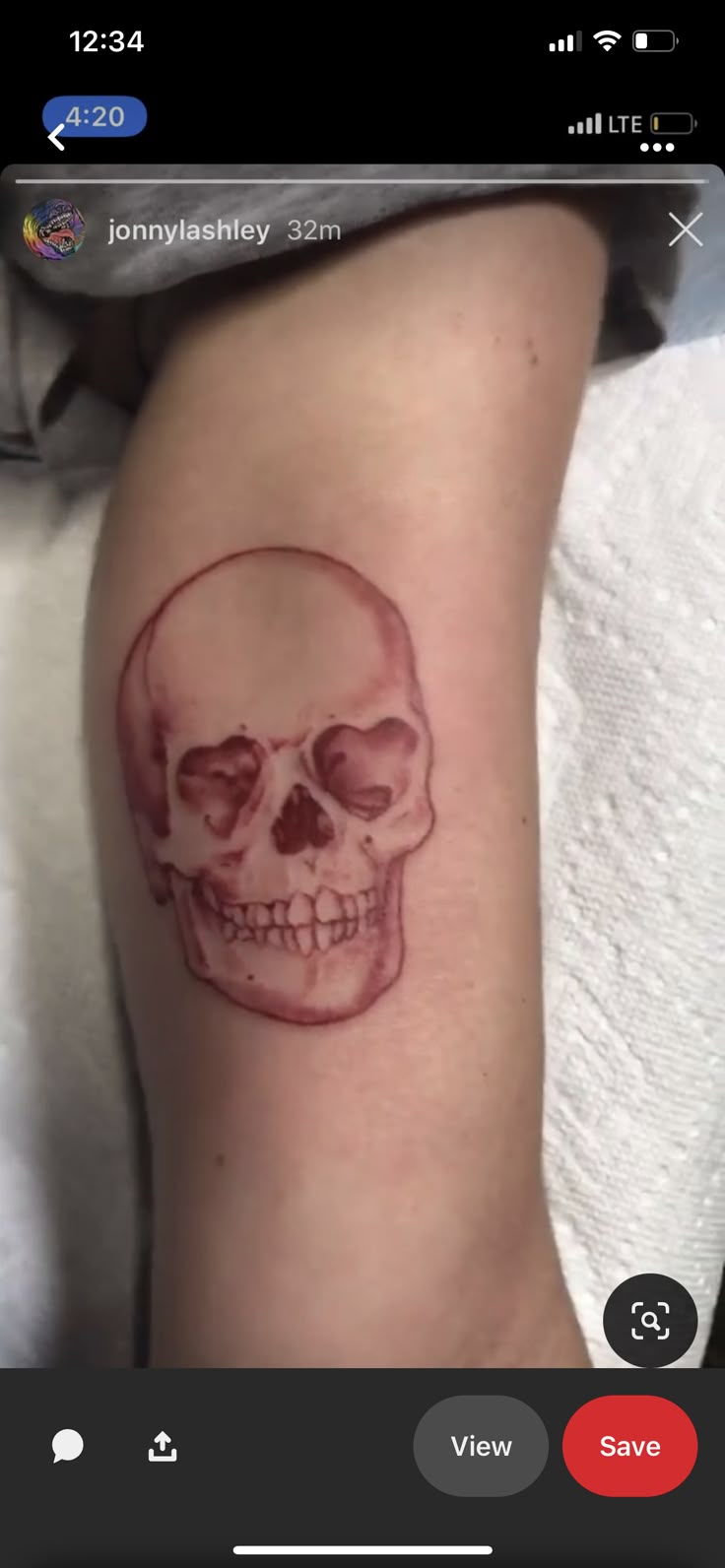 a person with a skull tattoo on their leg and the words send message below it