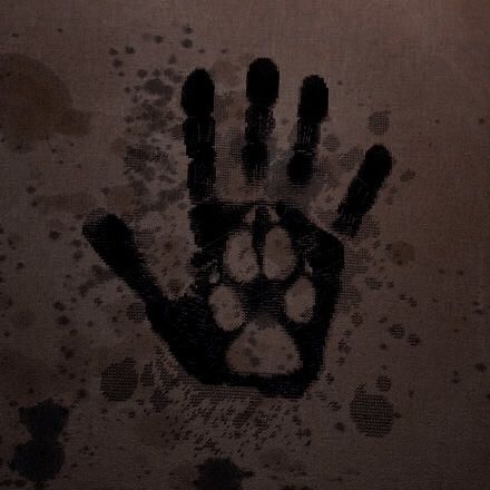 a hand print on the wall with black ink and white paint splattered all over it