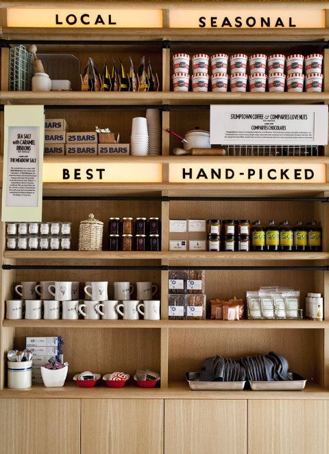 the shelves are filled with different types of spices and condiments, including coffee