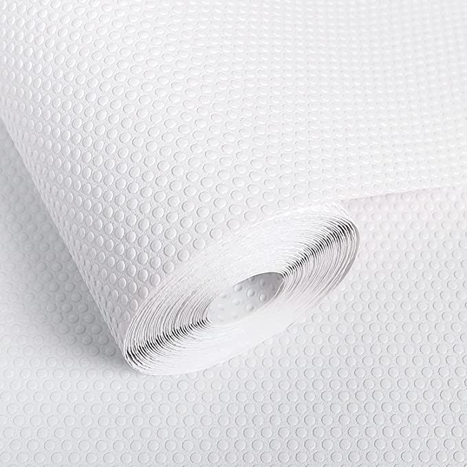 a roll of white paper on top of a table