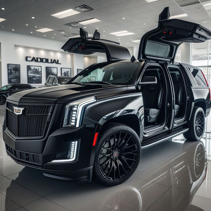 an suv with its doors open in a showroom