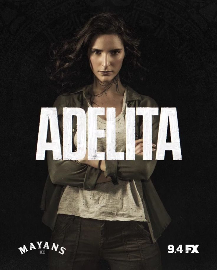 a woman standing in front of a black background with the words adelita on it