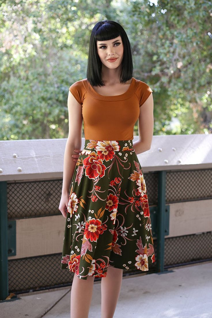 Vintage Inspired Clothing Check out the Charlotte: the perfect vintage style skirt! Made in a lightweight knit fabric, this circle skirt features large side pockets and a back zippered closure. Pair with your favorite mock neck top for that classic 1950's silhouette! Lightweight knit fabric Invisible back zipper closure Large pockets for all your essentials Made in USA Shown with 4085 Boat Neck Top in Brown Model: Size XS, 5'8" Fit information: Due to the fabric, you may want to size down from y 50s Style Outfits, Quirky Dress, Vintage Style Skirts, Vintage Inspired Clothing, Retro Skirt, Freshly Picked, Vintage Inspired Outfits, Floral Outfit, Mock Neck Top