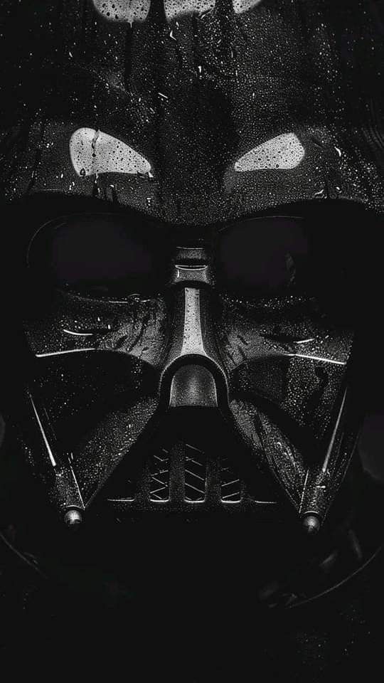 a darth vader helmet is shown in black and white with the words star wars written on it