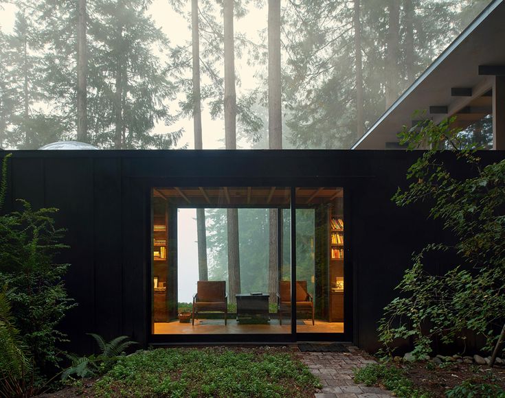 a small house in the middle of a forest