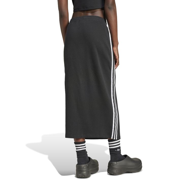 Sporty and feminine unite in the adidas Knitted Women's Skirt. When you want an outfit you can throw-on easily, this skirt makes it possible. Match it with other adidas apparel or a solid-colored tank for a simple look that makes a statement! Features adidas iconic three-stripe design. Provides for sleek silhouette. Has adjustable, elastic waistband. Fabric: 79% Cotton, 21% Polyester. Product consists of recycled materials. Made from Better Cotton. Machine washable. Sporty Black Pleated Skirt, Stretch Mini Skirt For Streetwear, Black Stretch Skirt For Streetwear, Trendy Stretch Skirt For Streetwear, Sporty Skirt For Sports, Spring Black Athleisure Skirt, Casual Long Skirt For Loungewear, Black Athleisure Skirt For Spring, Casual Sports Skirt