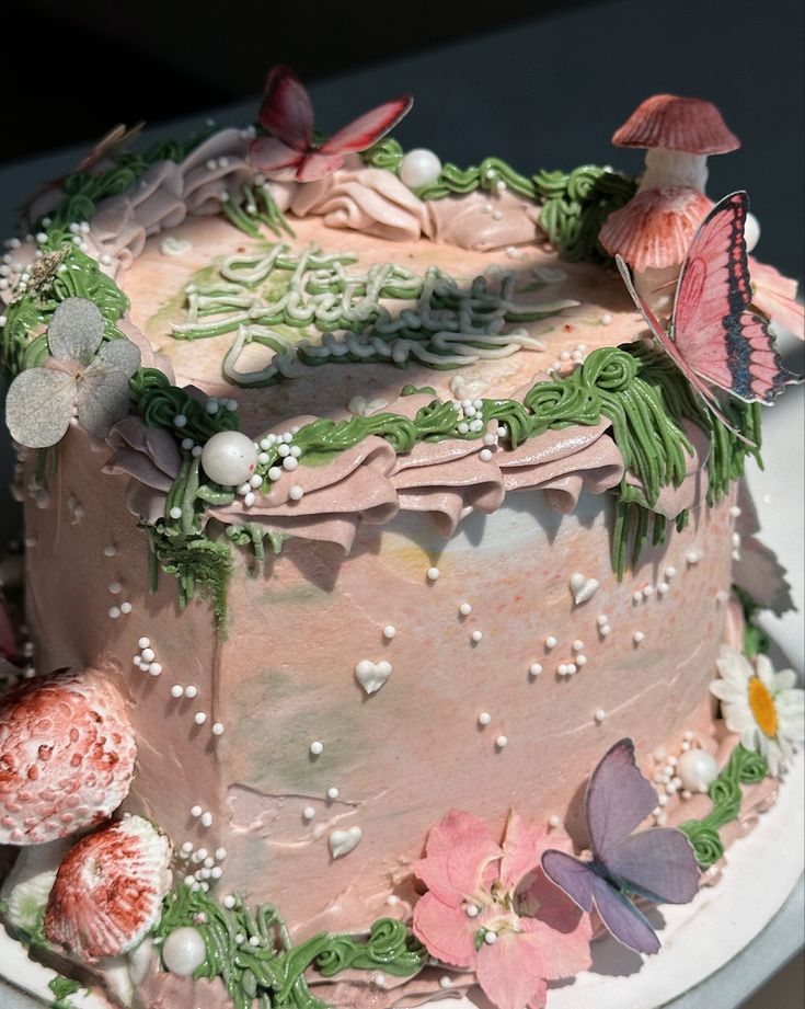 there is a cake decorated with flowers and butterflies