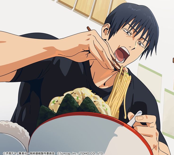 a man eating noodles with chopsticks in his hand