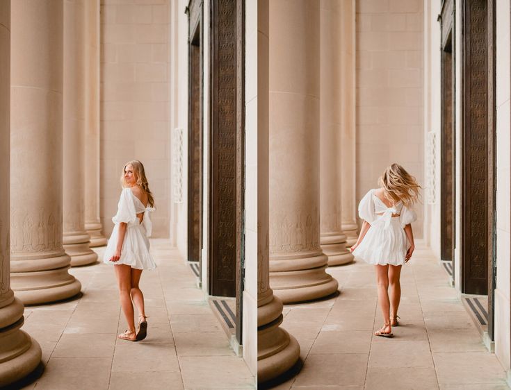 a woman in a white dress is standing near columns