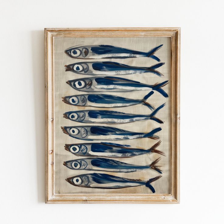 an image of fish on display in a wooden frame