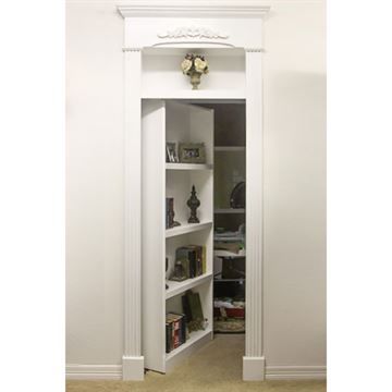 an open white bookcase in the corner of a room with carpeted flooring