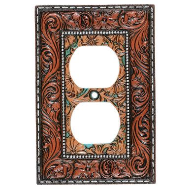 a decorative switch plate cover with an ornate design