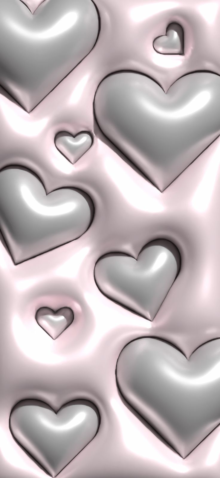 several silver hearts are arranged in the shape of heart shapes on a pink and gray background