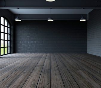 an empty room with wooden floors and large windows in the center is lit by three round lights