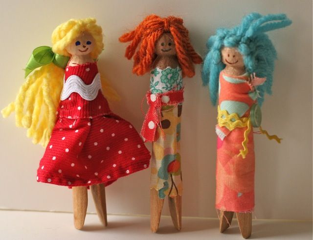 three dolls are standing next to each other