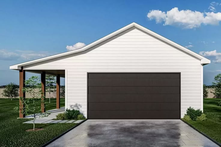 a white house with a black garage door