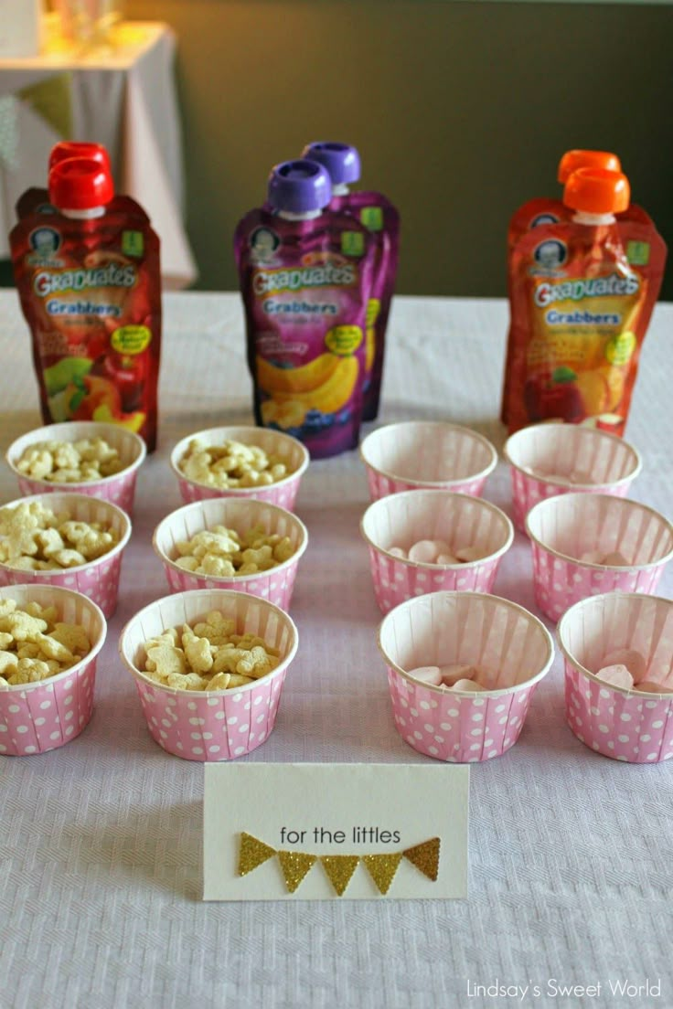 there are many small cups with food in them on the table next to each other