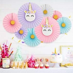 a unicorn themed birthday party with paper fans