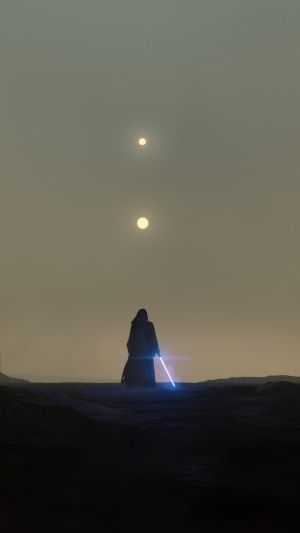 two people standing in the desert at night with their lights on and one person holding a light saber