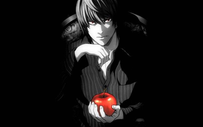 a man holding an apple in his hand