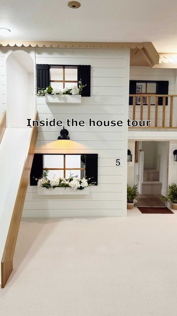 the inside of a house tour with stairs leading up to two story rooms and windows