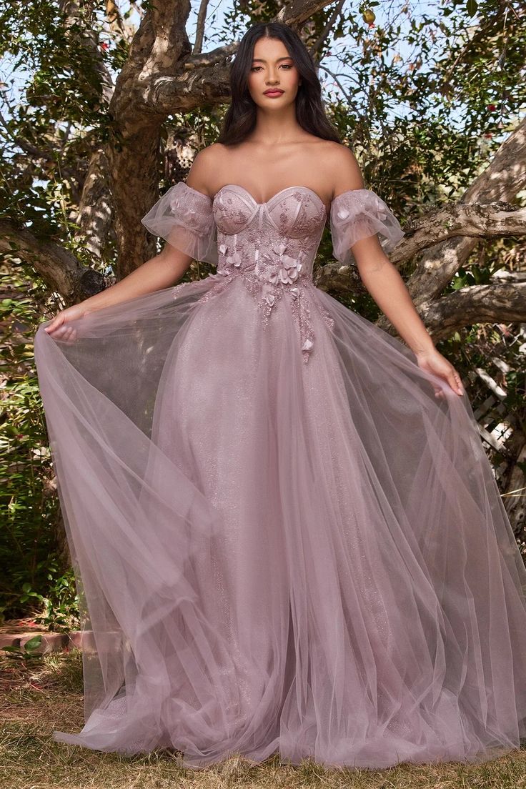 Cinderella Divine CB080 Runaway to the secret garden in this whimsical ball gown. Layered in luminescent luxe tulle this a-line is blossoming with floral appliques. The strapless structured bodice sits on the waistline attaching to optional off the shoulder puff sleeves Floral Ballgown, Ethereal Fashion, Puffy Tulle Skirt, Floral Ball Gown, Prom Fashion, Corsets Vintage, Tulle Balls, Cinderella Divine, Prom Ball Gown