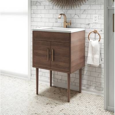 a bathroom sink with a mirror above it and a towel hanging on the wall next to it