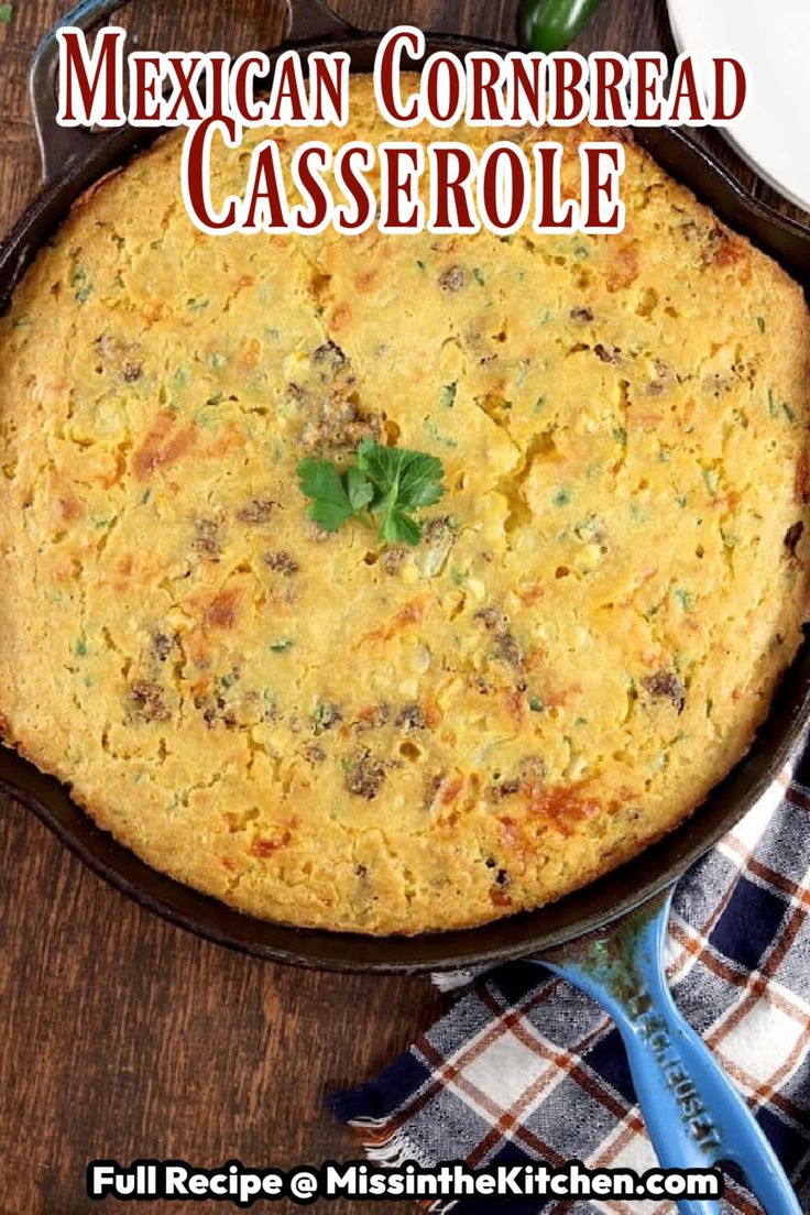 mexican cornbread casserole in a cast iron skillet on a wooden table