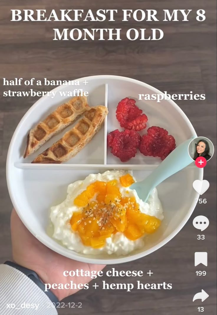 the breakfast for my 8 month old is shown on a plate with raspberries and waffles