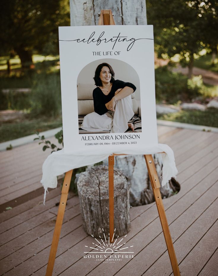 an easel with a sign that says celebrating the life of alexandria washington on it