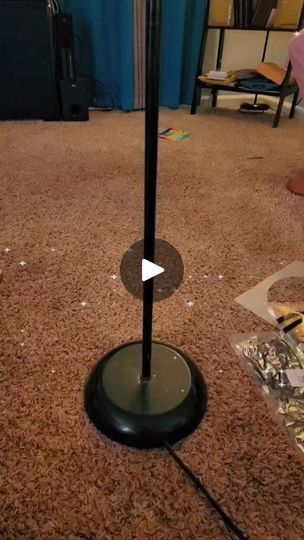 a floor lamp on the ground in a living room