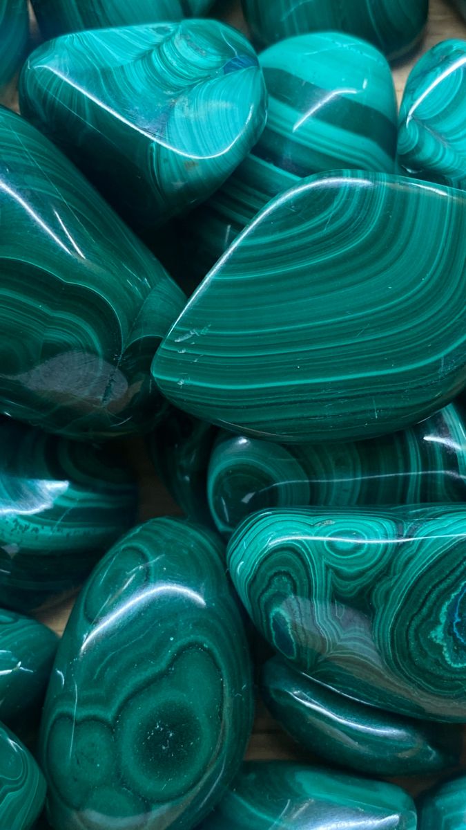 green marbles are stacked on top of each other