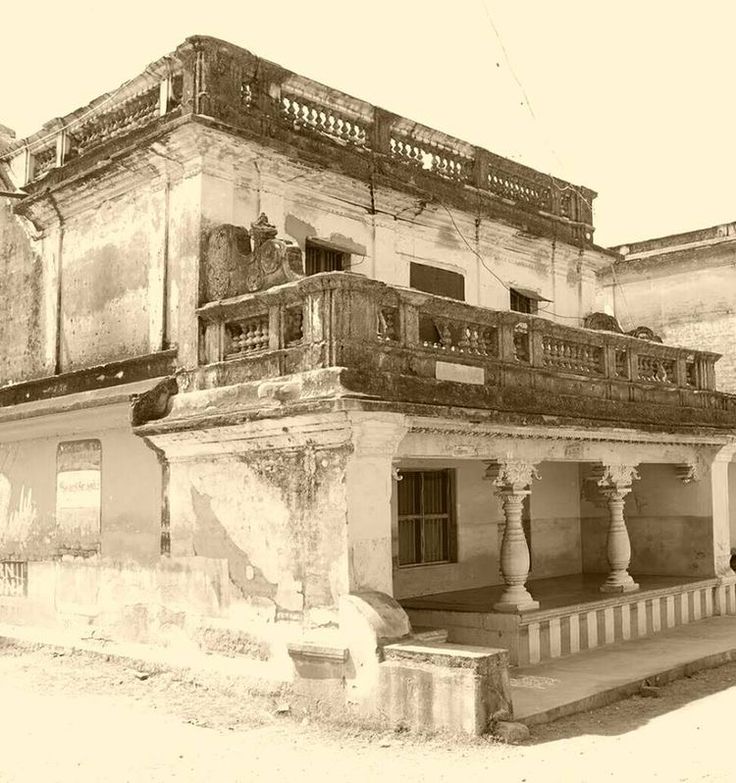 an old building with columns and balconies