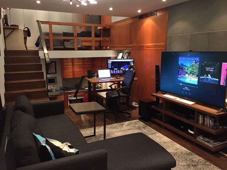 a living room filled with furniture and a flat screen tv