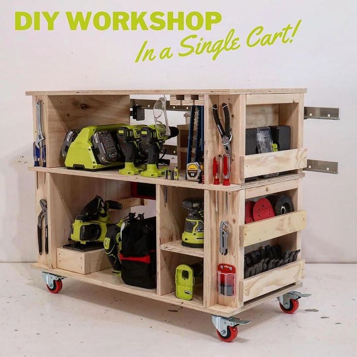 a wooden cart filled with lots of different types of work tools and equipment on wheels