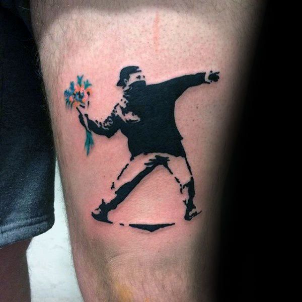 a man with a flower in his hand and the silhouette of a baseball player on his leg