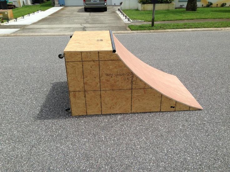 a skateboard ramp sitting in the middle of a street