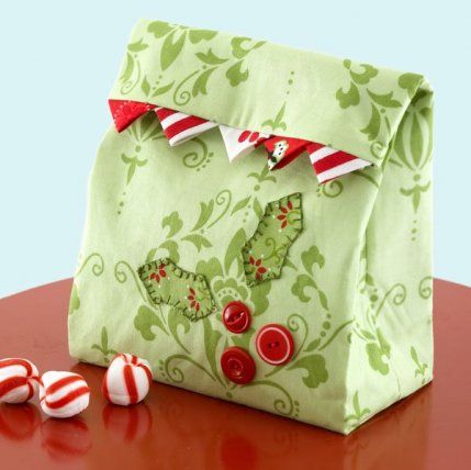 a bag sitting on top of a table with candy canes in front of it