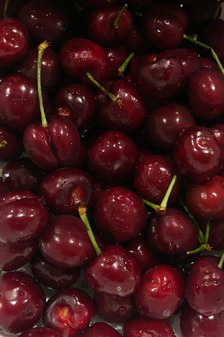 the cherries have been picked up and ready to be eaten in the kitchen or on the table