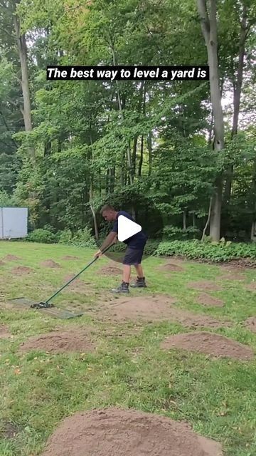 a man is using a lawn mower in the yard