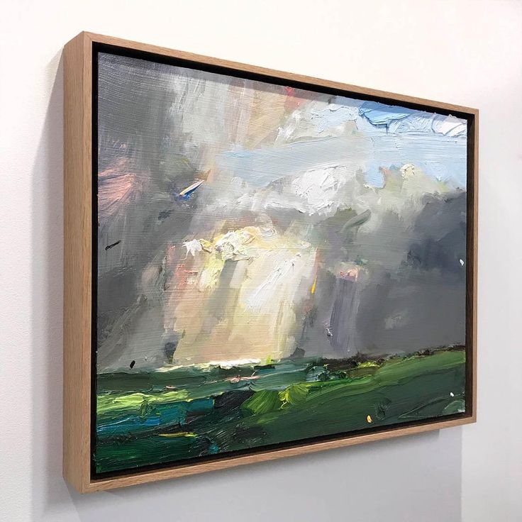 an abstract painting hangs on the wall