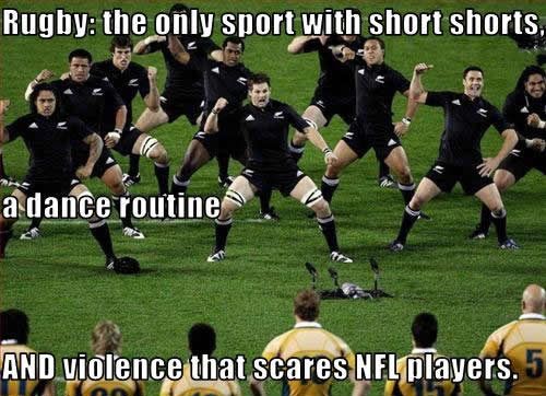 a group of men in black uniforms on a field with words that read rugby the only sport with short shorts, and a dance routine