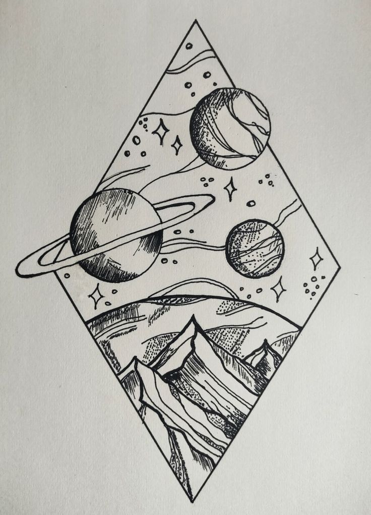 a drawing of planets and mountains on paper